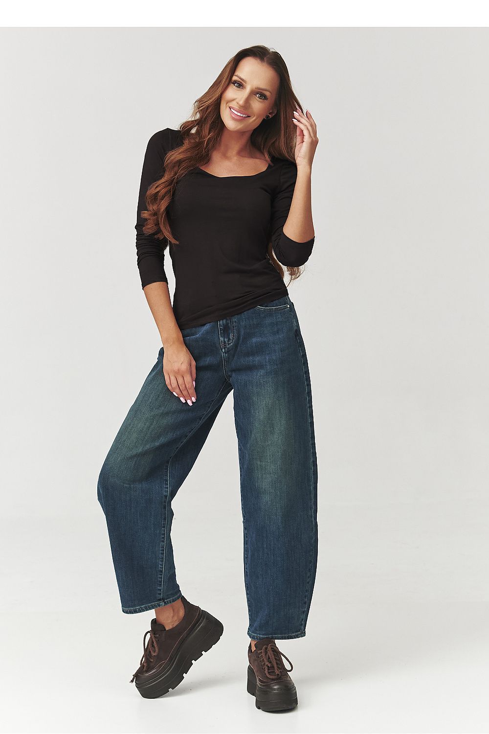 Sophisticated Makadamia women's blouse available in black, showcasing a chic checkered neckline, ideal for both casual and elegant outfits.