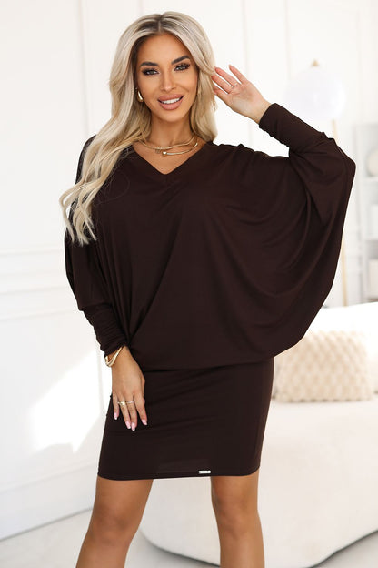 Elegant chocolate batwing evening dress by Numoco, featuring a deep V-neck and oversized top for a luxurious silhouette.