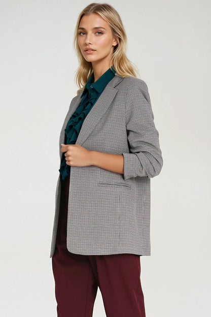 Elegant women's houndstooth jacket by Nife, featuring 3/4 sleeves, a flattering lapel collar, and a chic minimalist design, perfect for both business and casual occasions.