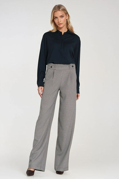 Wide leg women's trousers by Nife, showcasing a luxurious high-waist silhouette with decorative buttons and relaxed fit for a chic look.