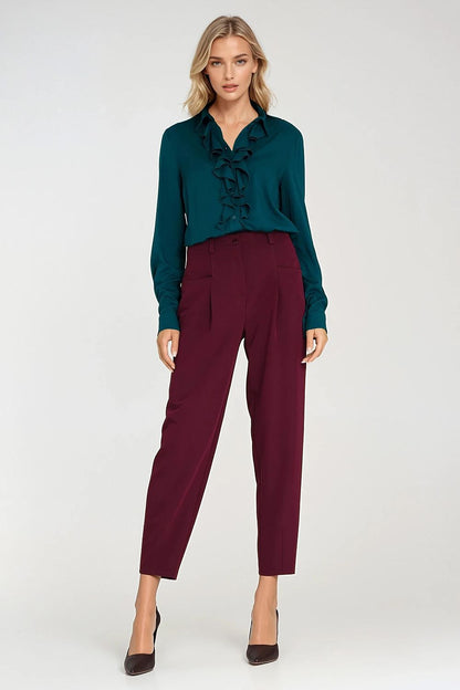 Stylish Nife oversized trousers with large square pockets, ideal for a chic, contemporary look, suitable for sizes EU 36-42.