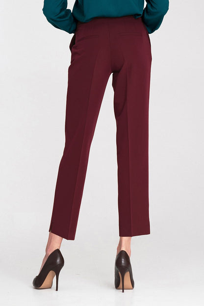 Luxury Nife women's trousers showcasing a modern taper and pressed creases, suitable for sophisticated office or casual wear.