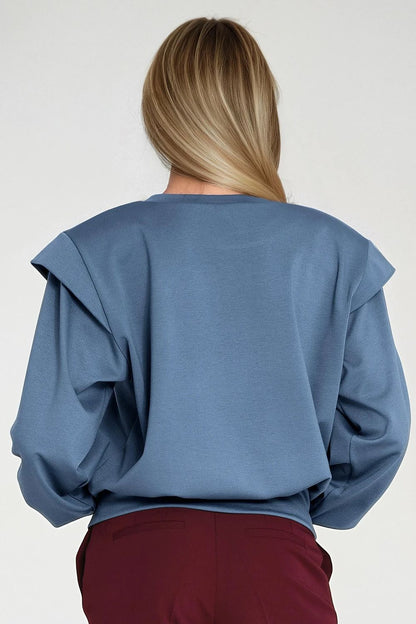 Elegant women's oversized sweatshirt by Nife, tailored with shoulder pads and ribbed cuffs, effortlessly combining comfort and high-fashion appeal.