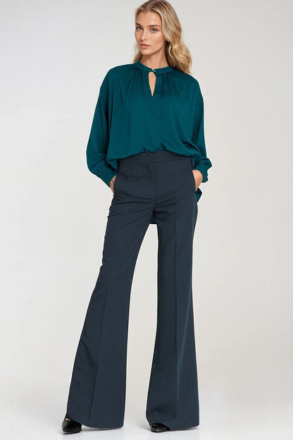 Chic women's trousers by Nife with a stylish flared leg design, enhancing the silhouette for a luxurious, feminine look.
