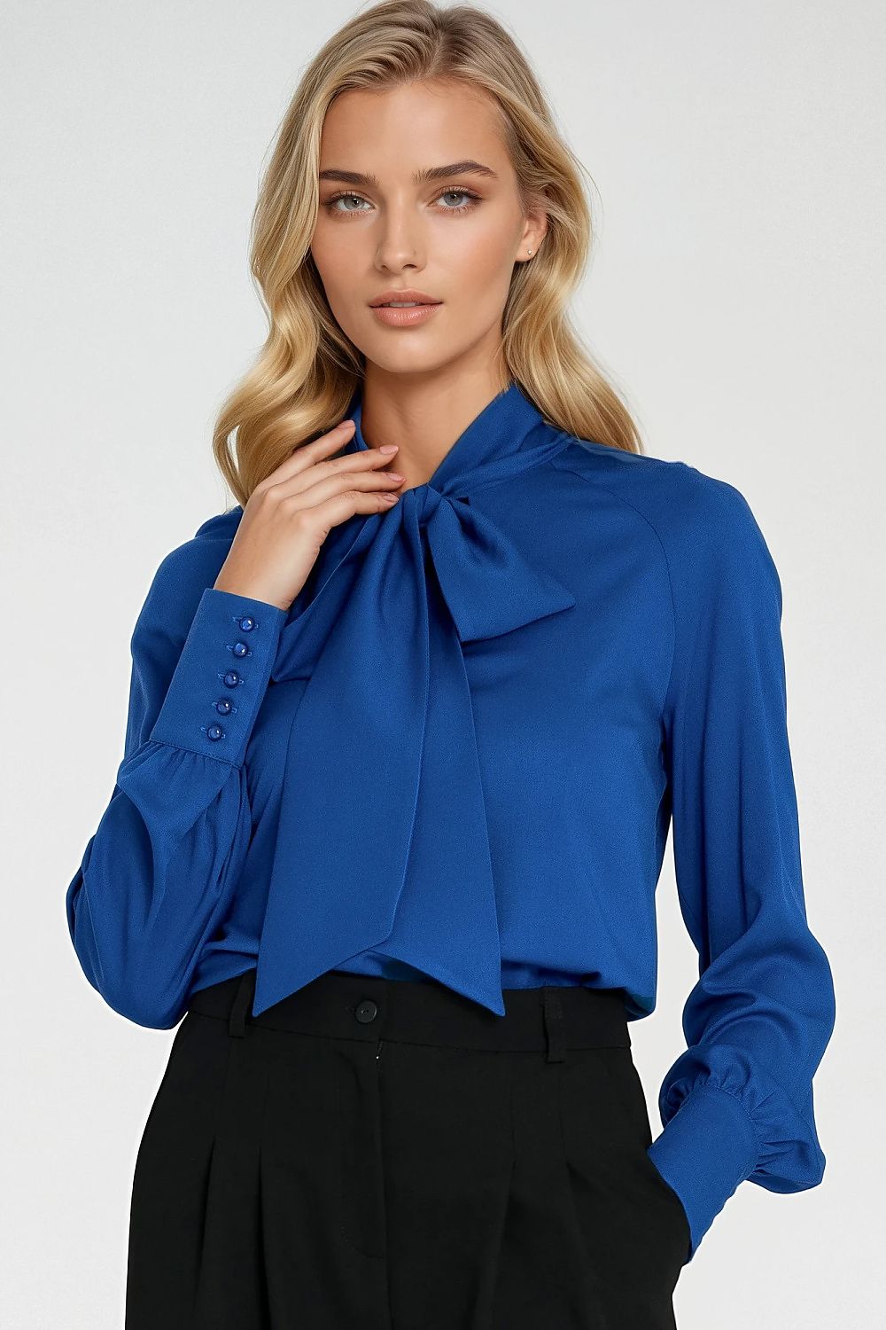 Nife elegant women's viscose blouse with decorative cuff buttons, showcasing a stylish design ideal for versatile occasions.