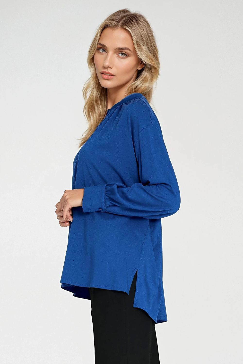 Nife elegant oversized viscose blouse displayed on a model, highlighting its comfortable fit and versatility in both formal and casual outfits.