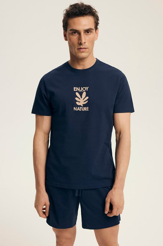 Luxury women's cotton pyjamas set by Henderson featuring a loose fit T-shirt and comfortable shorts, perfect for relaxing at home.