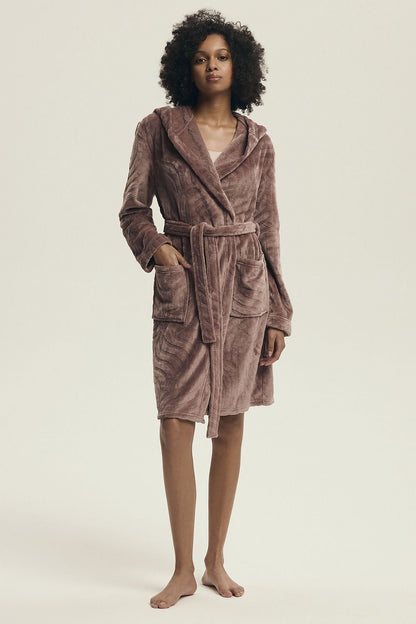 Luxurious Henderson women's hooded bathrobe in soft polyester, featuring knee-length design, practical pockets, and feminine embossed pattern, perfect for relaxing at home.