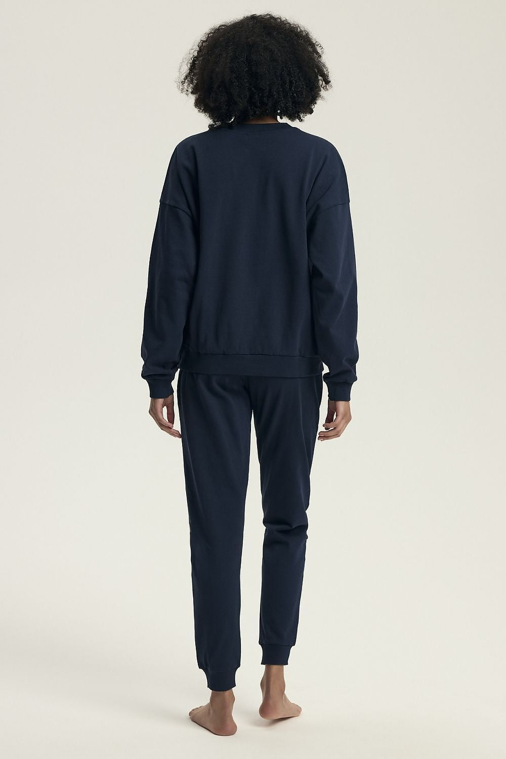 Soft and breathable Henderson women's pajamas showcasing a modern casual design with a round neckline and cuffs, ideal for a luxurious homewear experience.