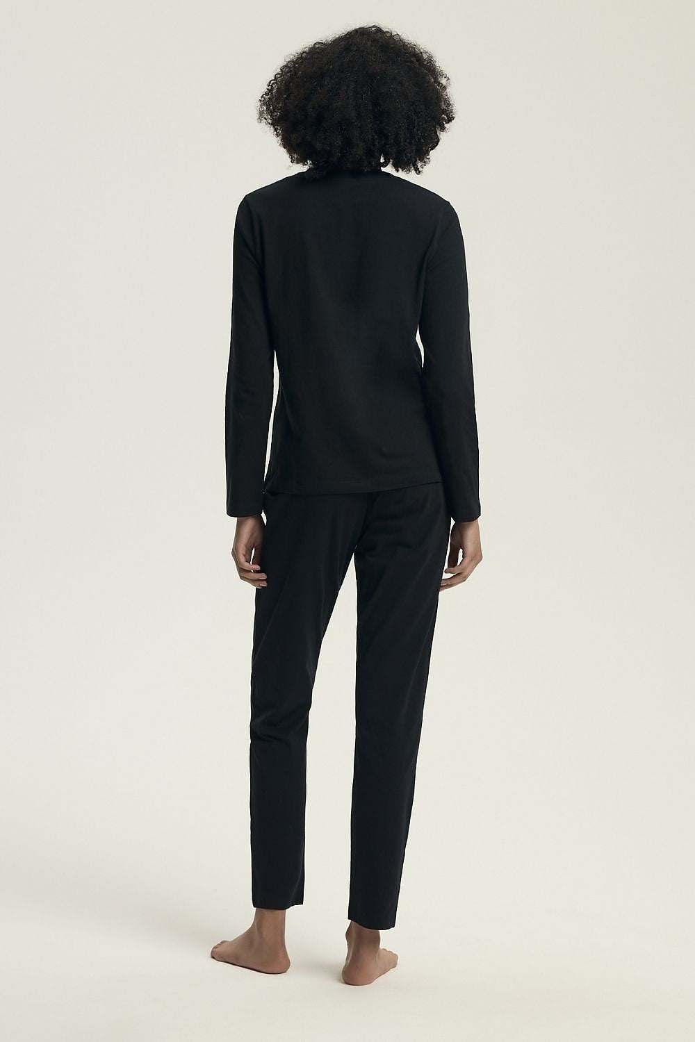 Luxurious Henderson women's cotton pyjama set featuring a classic long sleeve blouse with modern slogan detailing and wide elastic pants, available in sizes S to XXL, perfect for elegant home relaxation.