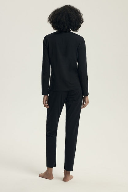 Luxurious Henderson women's cotton pyjama set featuring a classic long sleeve blouse with modern slogan detailing and wide elastic pants, available in sizes S to XXL, perfect for elegant home relaxation.