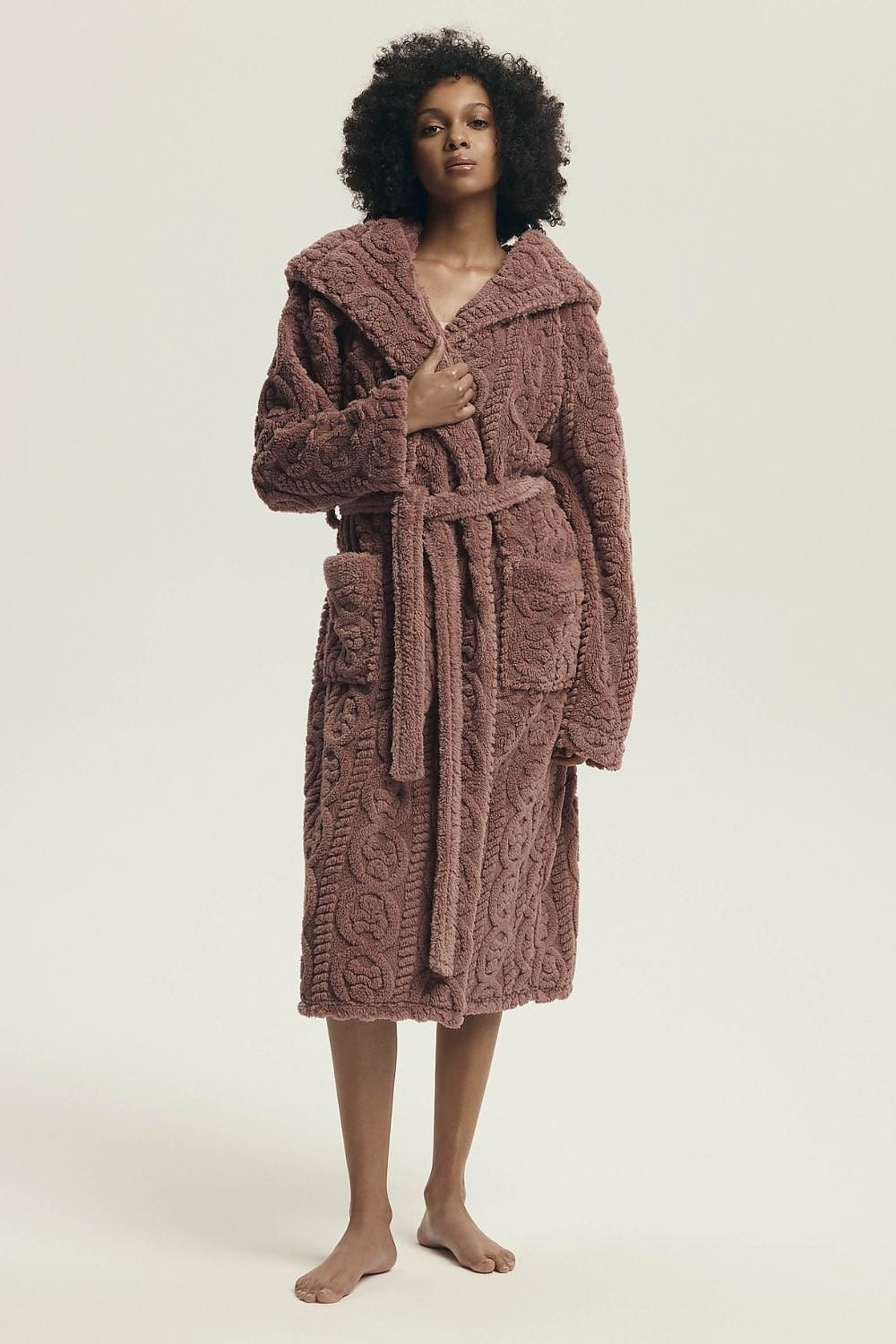 Henderson Women's Knee-Length Quilted Bathrobe featuring a hood, elegantly designed with practical pockets and a comfortable tie waist, ideal for luxury homewear.