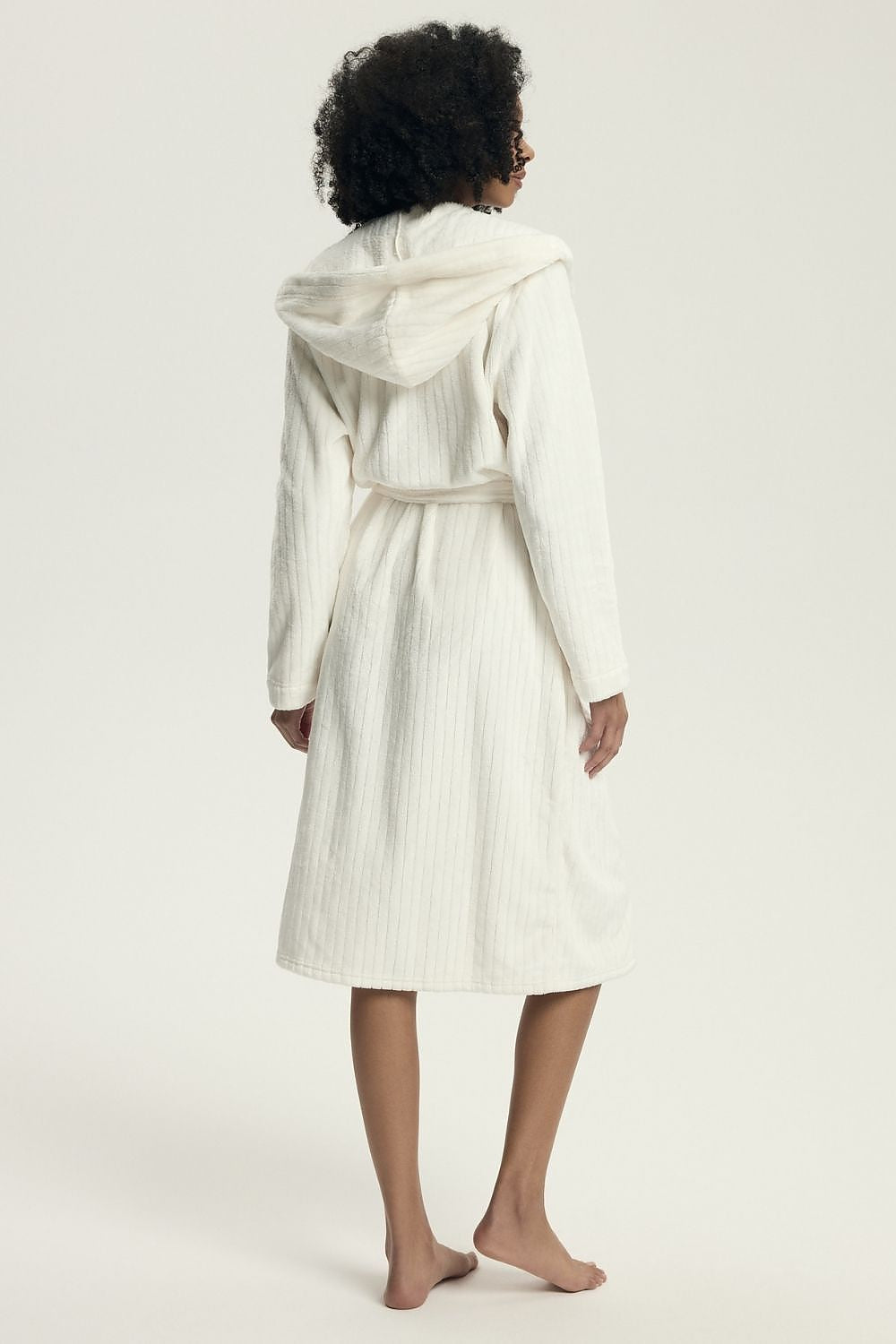 Elegant knee-length quilted bathrobe for women by Henderson, perfect for colder days with a comfortable loose fit and chic style.