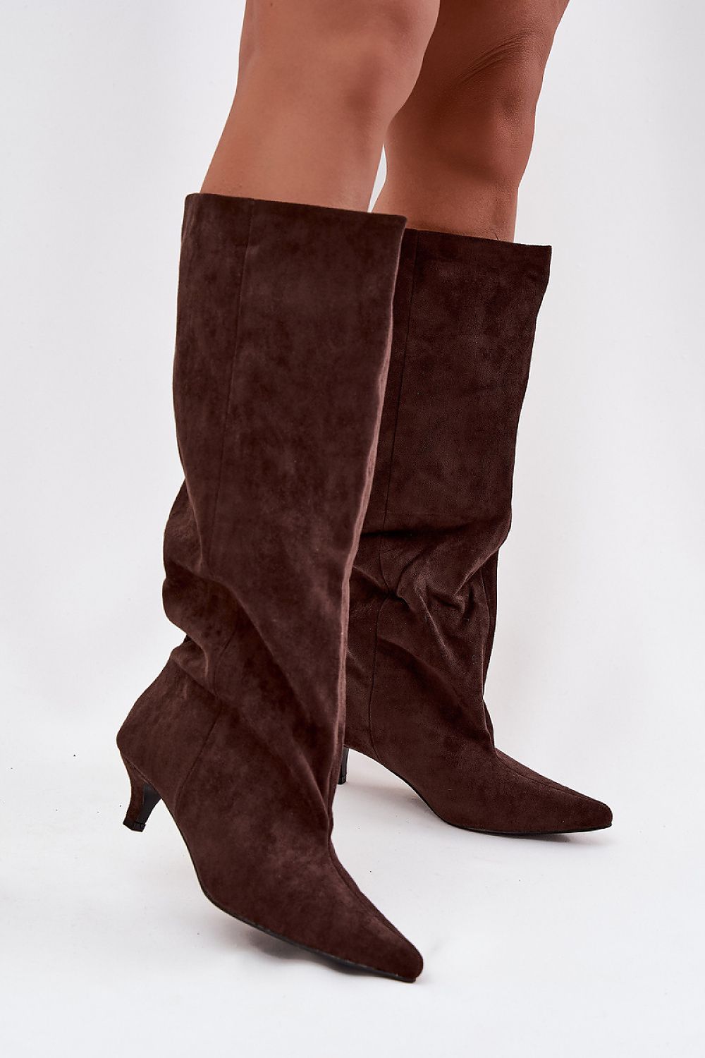 Elegant women's faux suede heel boots crafted by Step in Style, featuring a low heel for comfort and a slip-on design, available in sizes EU 36-41.