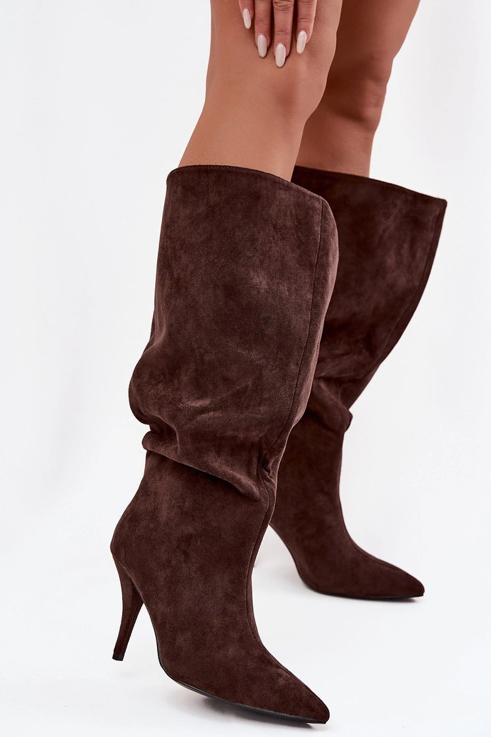 Chic women's slip-on faux suede boots from Step in Style, showcasing a comfortable low heel and timeless design, perfect for enhancing any wardrobe.