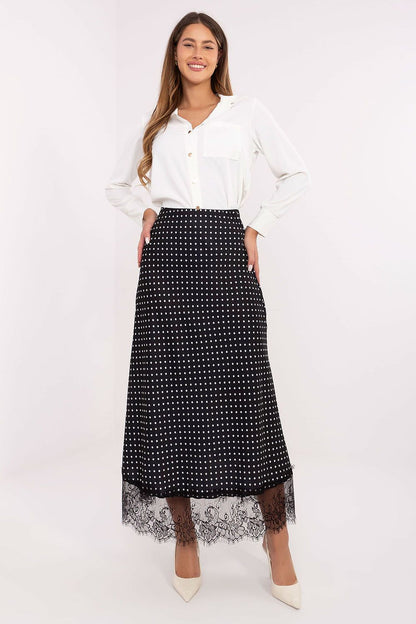 Elegant Rue Paris midi skirt featuring lace detailing and trendy polka dots, showcasing a sophisticated design perfect for versatile wear.