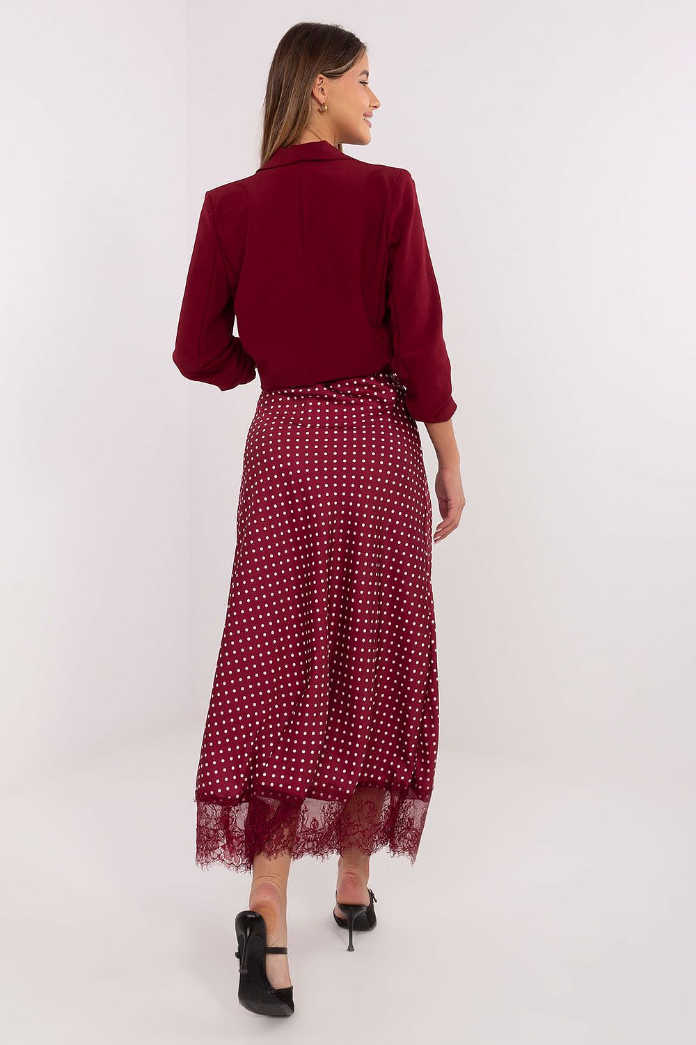 Stylish midi skirt by Rue Paris featuring a comfortable fit with an elastic waist, adorned with intricate lace detailing and a charming polka dot design.
