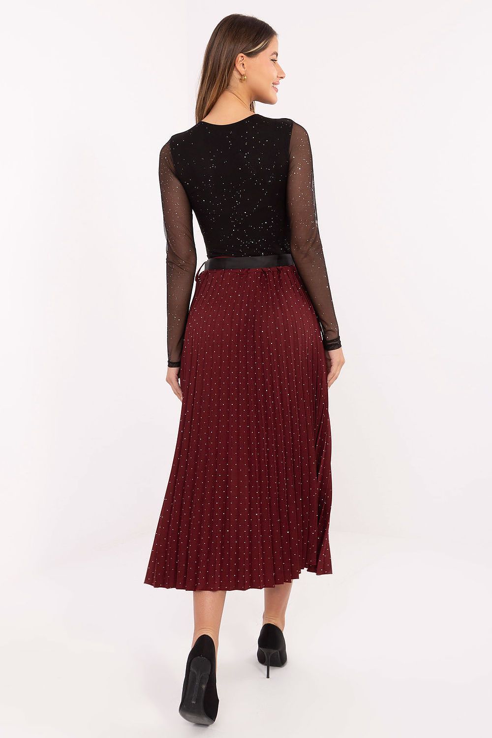 Model wearing Rue Paris pleated midi skirt with elastic waistband, illustrating its graceful silhouette and comfortable fit.
