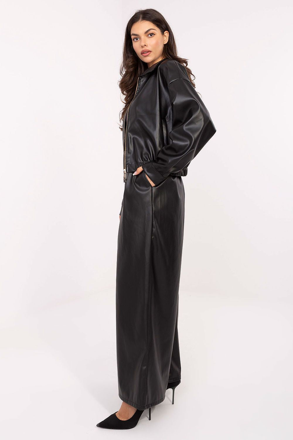 Luxury eco-leather palazzo trousers in a minimalist style by Rue Paris, featuring an elastic waistband, side pockets, and a fastening belt for an elegant silhouette.