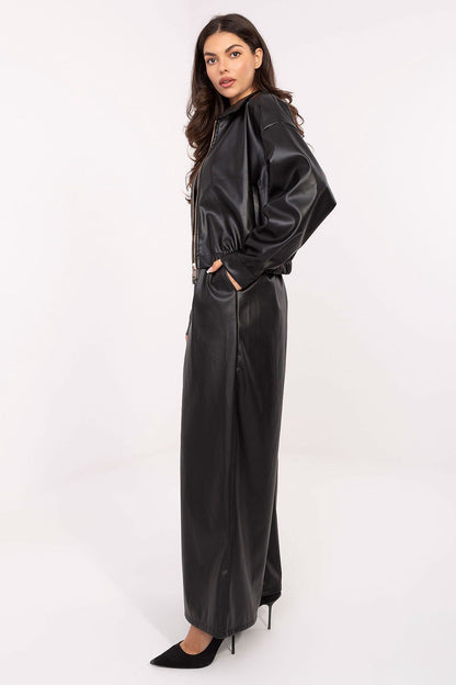 Luxury eco-leather palazzo trousers in a minimalist style by Rue Paris, featuring an elastic waistband, side pockets, and a fastening belt for an elegant silhouette.