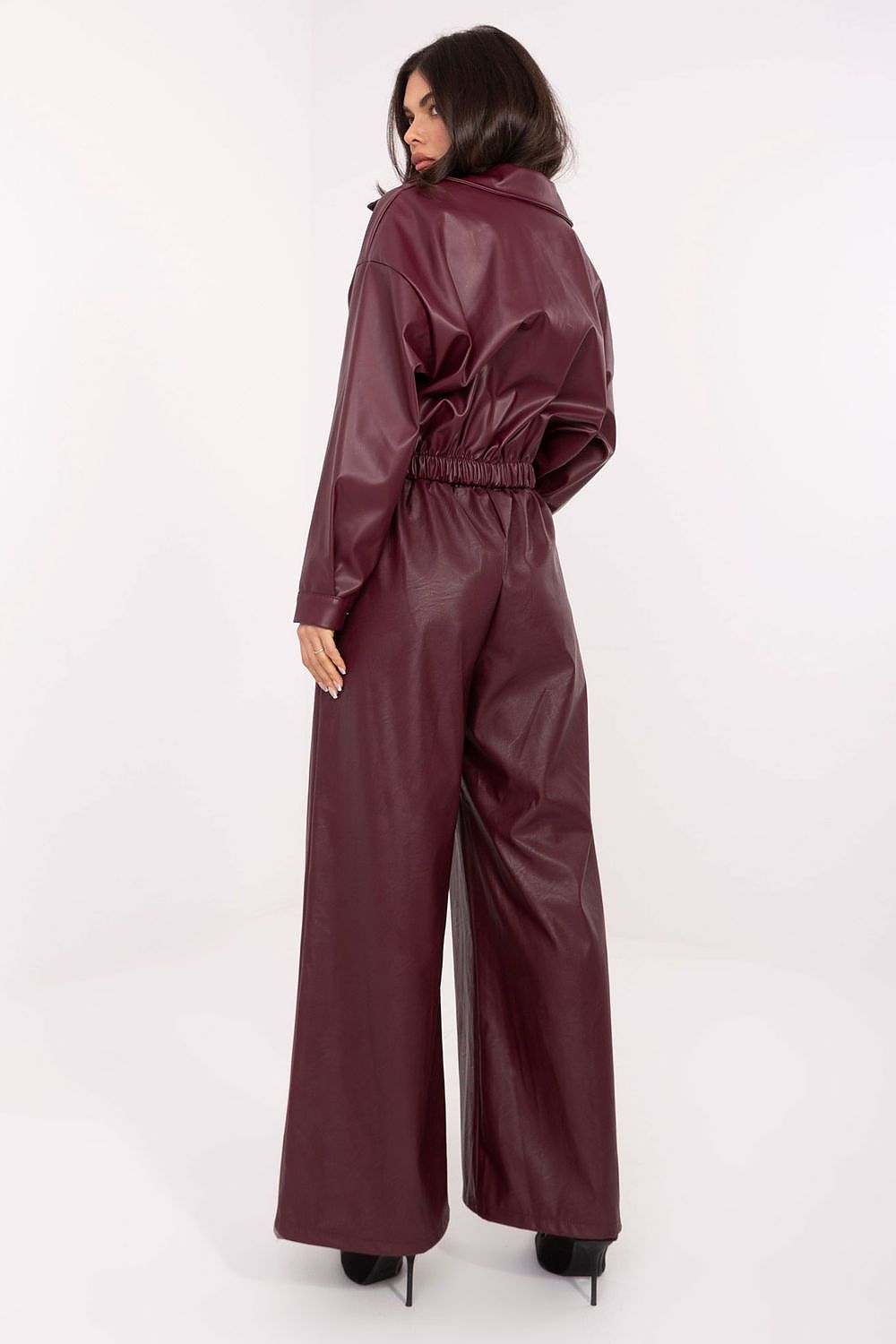 Model wearing Rue Paris high-waisted palazzo pants, exemplifying chic casual style with side slip pockets and refined fit.