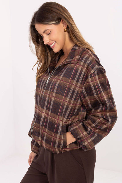 Close-up of the intricate animal print and check pattern on Rue Paris women's jacket, showcasing luxury and sophisticated design.