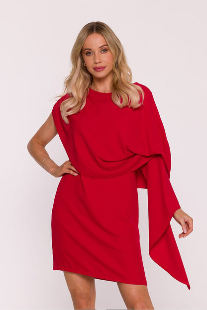 Stylove cocktail dress worn by a model, highlighting the flowing cape and fitted silhouette for an elegant and contemporary look.