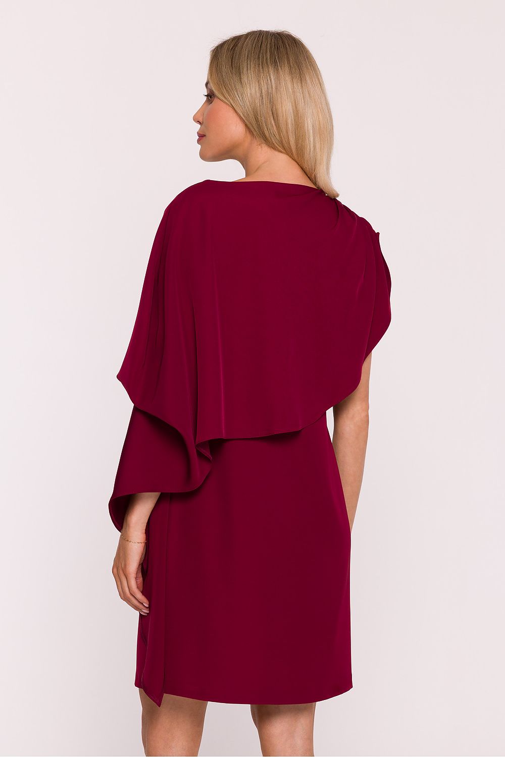 Stylove elegant cocktail dress featuring a stylish cape, designed for modern women who appreciate luxury and sophistication. Perfect for evening events, showcasing a subtle shine and flattering silhouette available in sizes S to XXL.