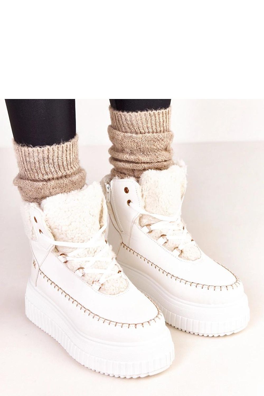 Solea ankle boots showcasing a chic 6.5cm platform, designed for ultimate comfort and warmth, ideal for colder days.