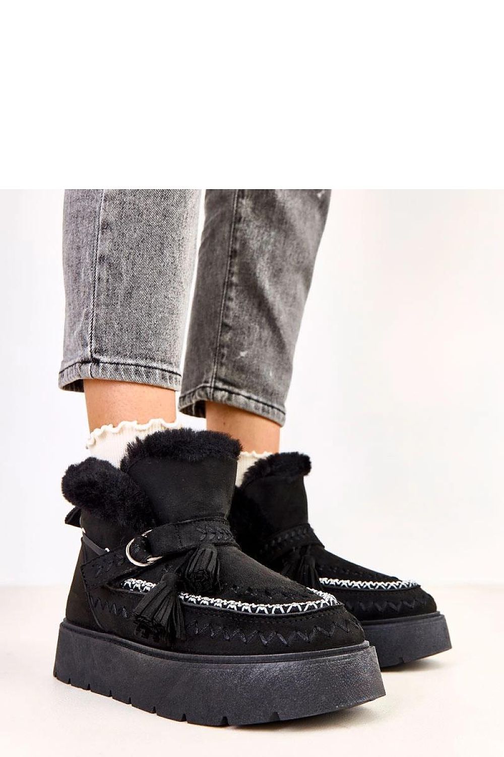 Elegant Solea luxury slip-on snow boots with decorative fringes, fur lined for winter warmth, showcasing a stylish beige suede finish.