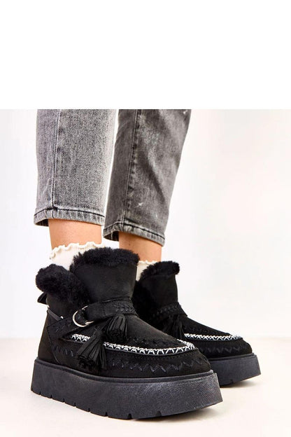 Elegant Solea luxury slip-on snow boots with decorative fringes, fur lined for winter warmth, showcasing a stylish beige suede finish.