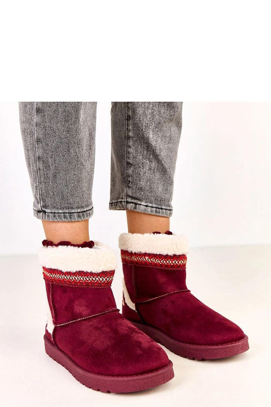 Solea luxury slip-on snow boots featuring intricate decorative embroidery and a plush fur lining, designed for superior comfort and style in winter.