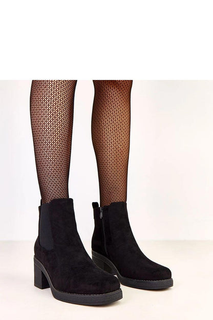 Elegant 7cm heeled boots by Solea, featuring a chic side elastic insert in eco suede for a luxurious winter look.