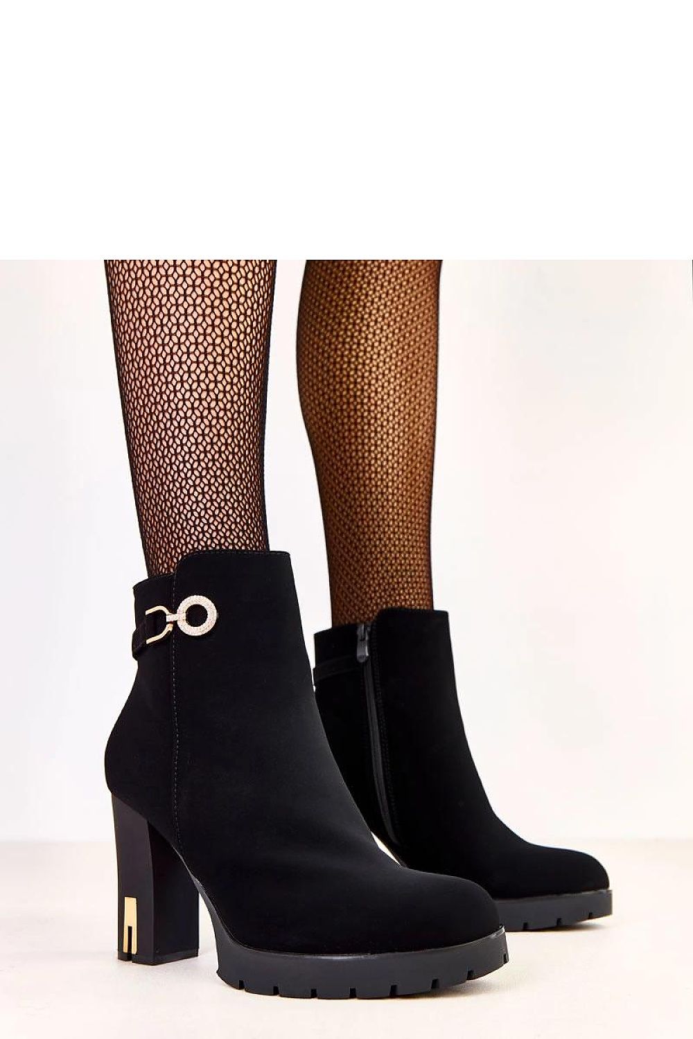 Elegant Solea Ankle Boots in eco-friendly suede with 9.5 cm heel, featuring a stylish metal decoration and insulated for winter comfort.