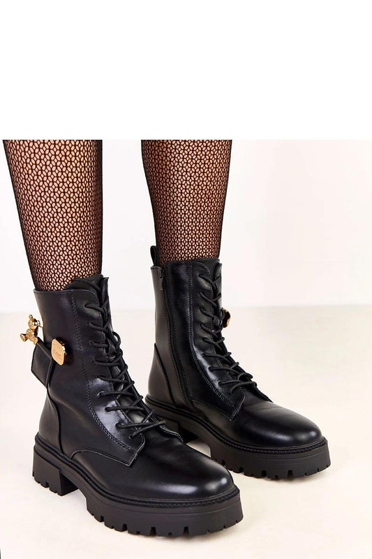 Elegant stylish women's ankle boots by Solea featuring a side zipper, 5 cm heel, and a decorative gold teddy bear charm.