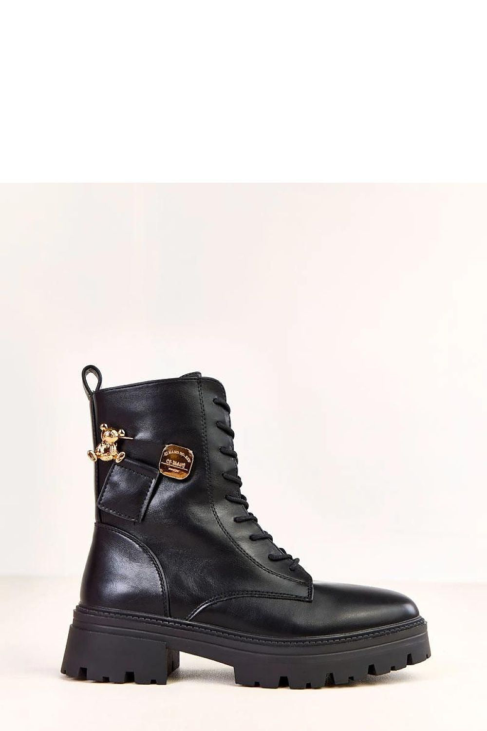 Fashionable women's ankle boots by Solea, exhibiting a unique teddy bear charm and stable 5 cm heel for effortless elegance.