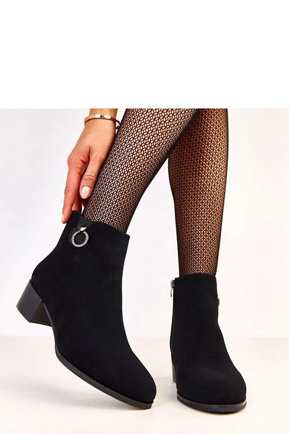 Close-up of Solea elegant heel boots in ecological suede, highlighting the exquisite decoration and soft texture.