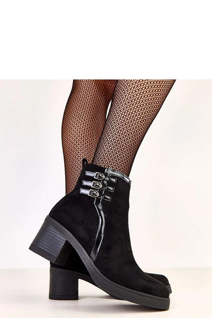 Close-up view of Solea women's eco suede ankle boots featuring decorative buckles and a comfortable fabric insole.