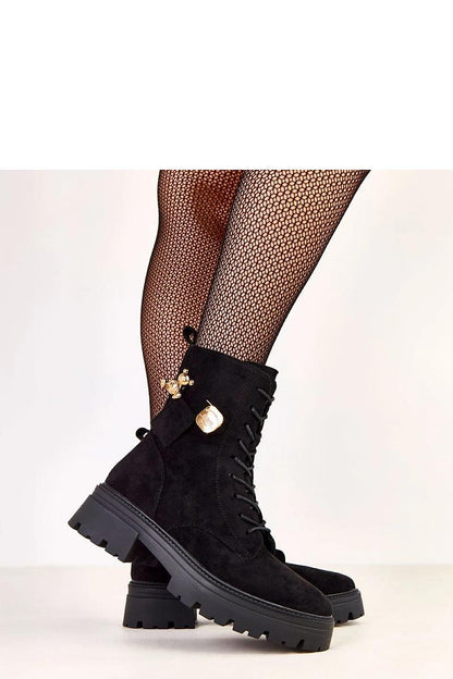 Close-up of Solea's chic suede-like eco leather work boots with decorative gold teddy bear charm and practical side zipper for stylish functionality.