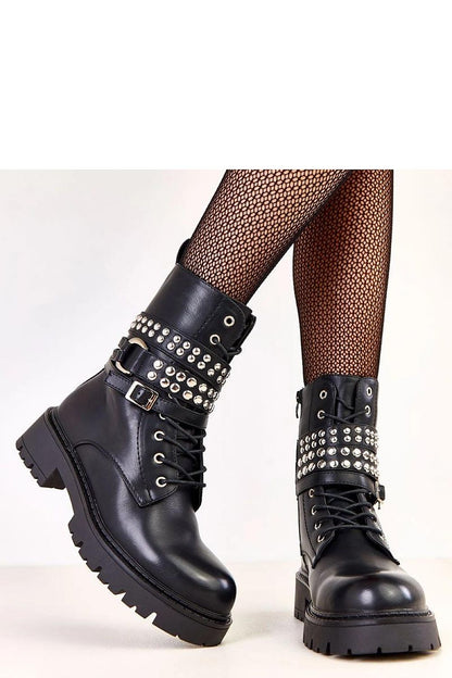 Chic Solea ankle boots with a round toe design, featuring an insulated upper and sleek zip closure, blending modern aesthetics with premium materials.