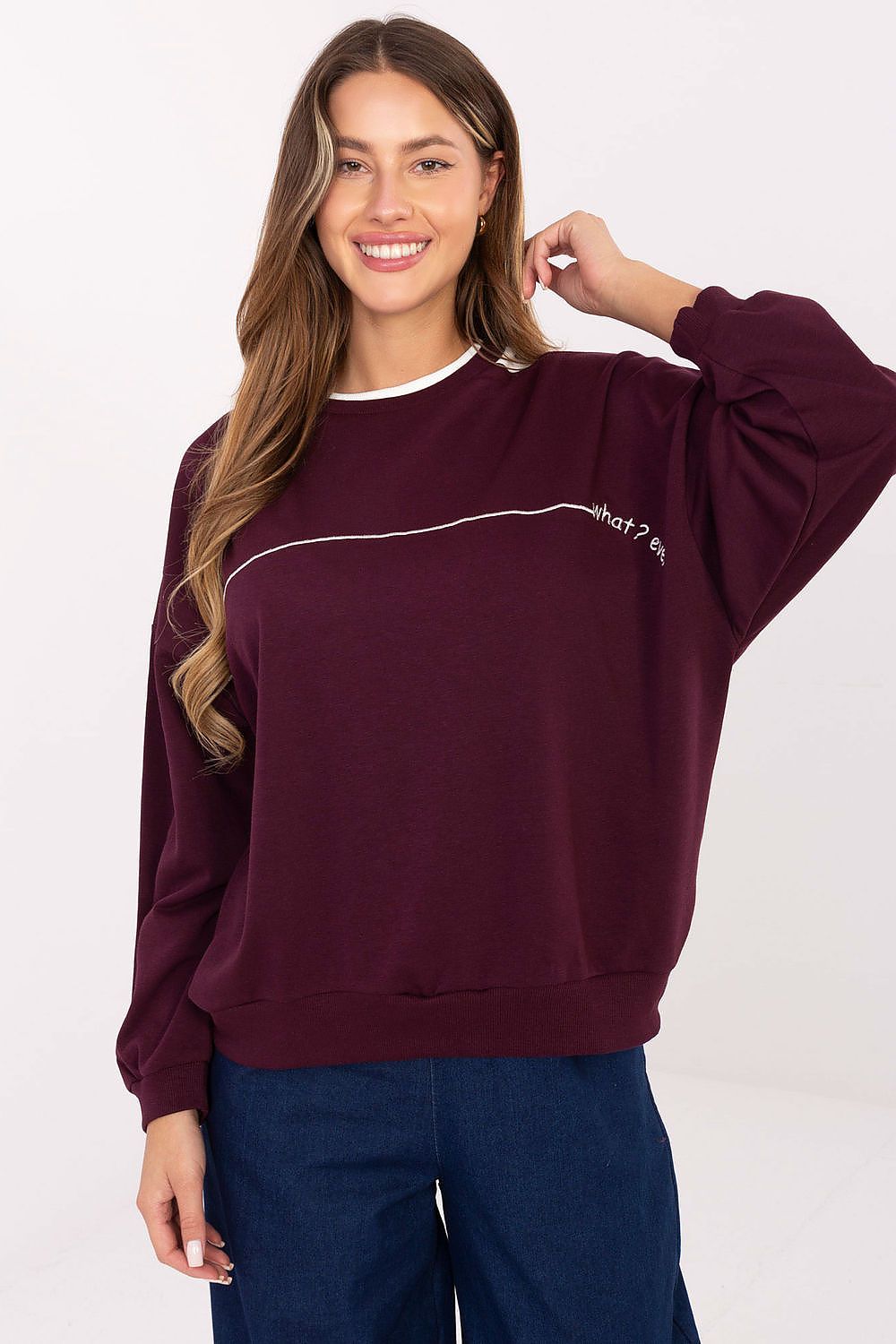 Fashion-forward oversized women's sweatshirt by Relevance, showcasing a unique design with embroidery, suitable for pairing with skirts and trousers.