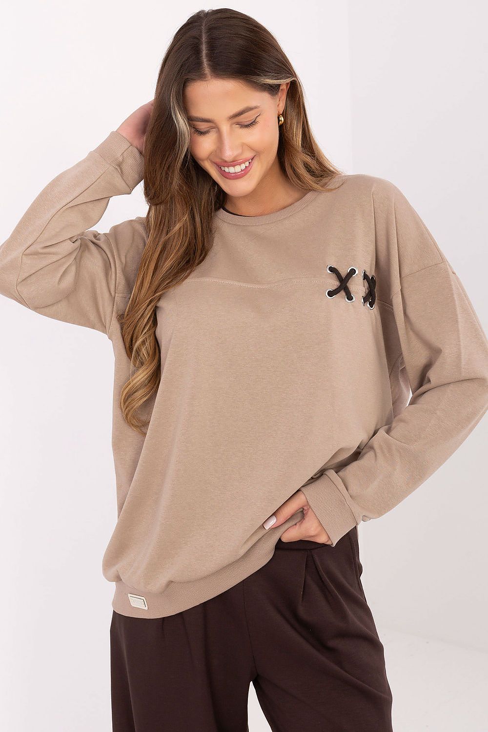 Luxury oversized women's sweatshirt from Relevance featuring a stylish braided detail, made of a soft 70% cotton blend, perfect for chic everyday wear.