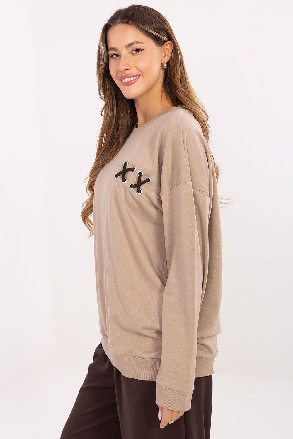 Elegant oversized women's sweatshirt by Relevance, showcasing a round neckline and long sleeves, designed for comfort and style in cooler weather.