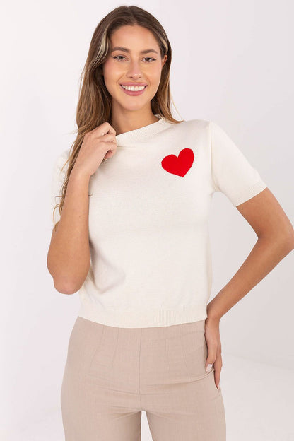 Close-up of the heart print on a beautiful short sleeve women's sweater, exquisitely made from a viscose blend for comfort by Factory Price.