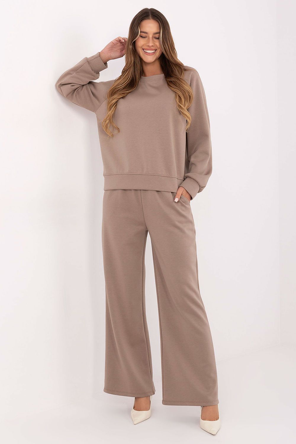 Luxury women's tracksuit set featuring soft butter-like fabric, designed by Factory Price, showcasing a chic loose blouse and high-waisted pants for elegant comfort.