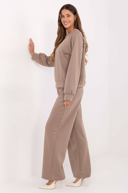 Close-up of the luxurious butter-like fabric of the women's tracksuit set by Factory Price, highlighting its delicate texture and flexibility for modern style.