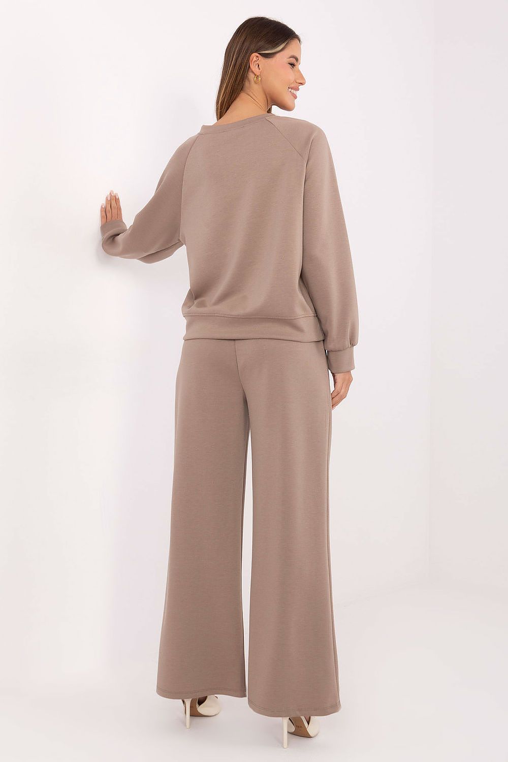 High-waisted pants from the luxury women's tracksuit set by Factory Price, designed for a flattering silhouette with side pockets for practicality.
