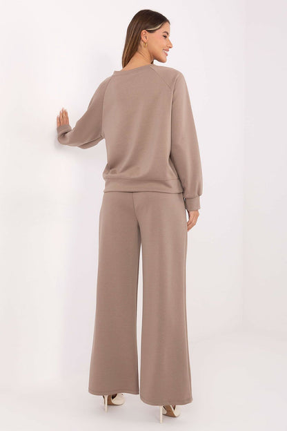 High-waisted pants from the luxury women's tracksuit set by Factory Price, designed for a flattering silhouette with side pockets for practicality.