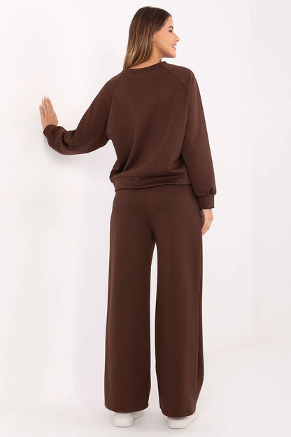 Elegant luxury women's tracksuit set by Factory Price, featuring soft butter-like fabric, high-waisted pants, and a casual blouse, perfect for stylish comfort in everyday wear.