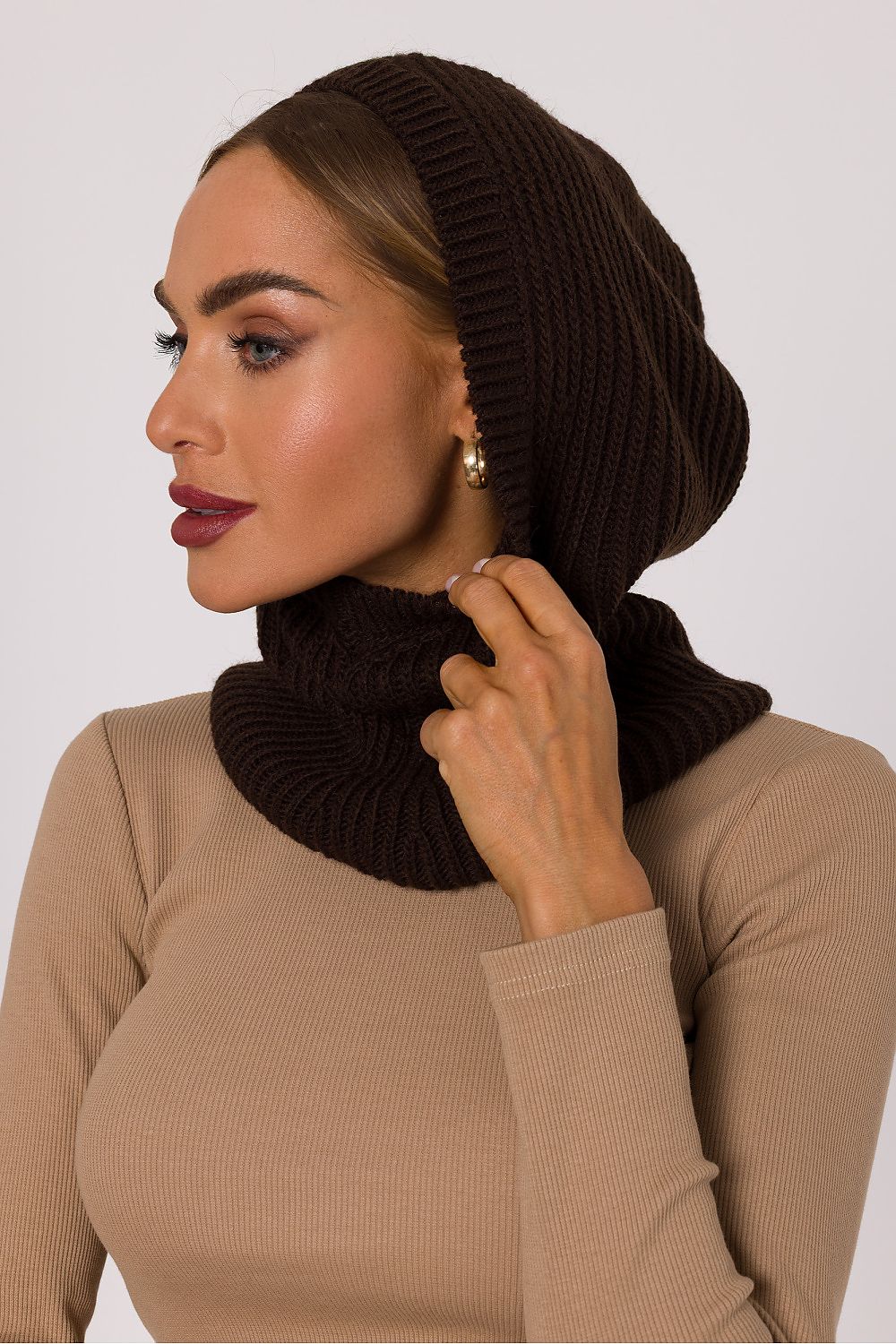 Side angle of the luxurious Moe balaclava, showcasing its elegant shape and soft fabric blend for a sophisticated winter look.